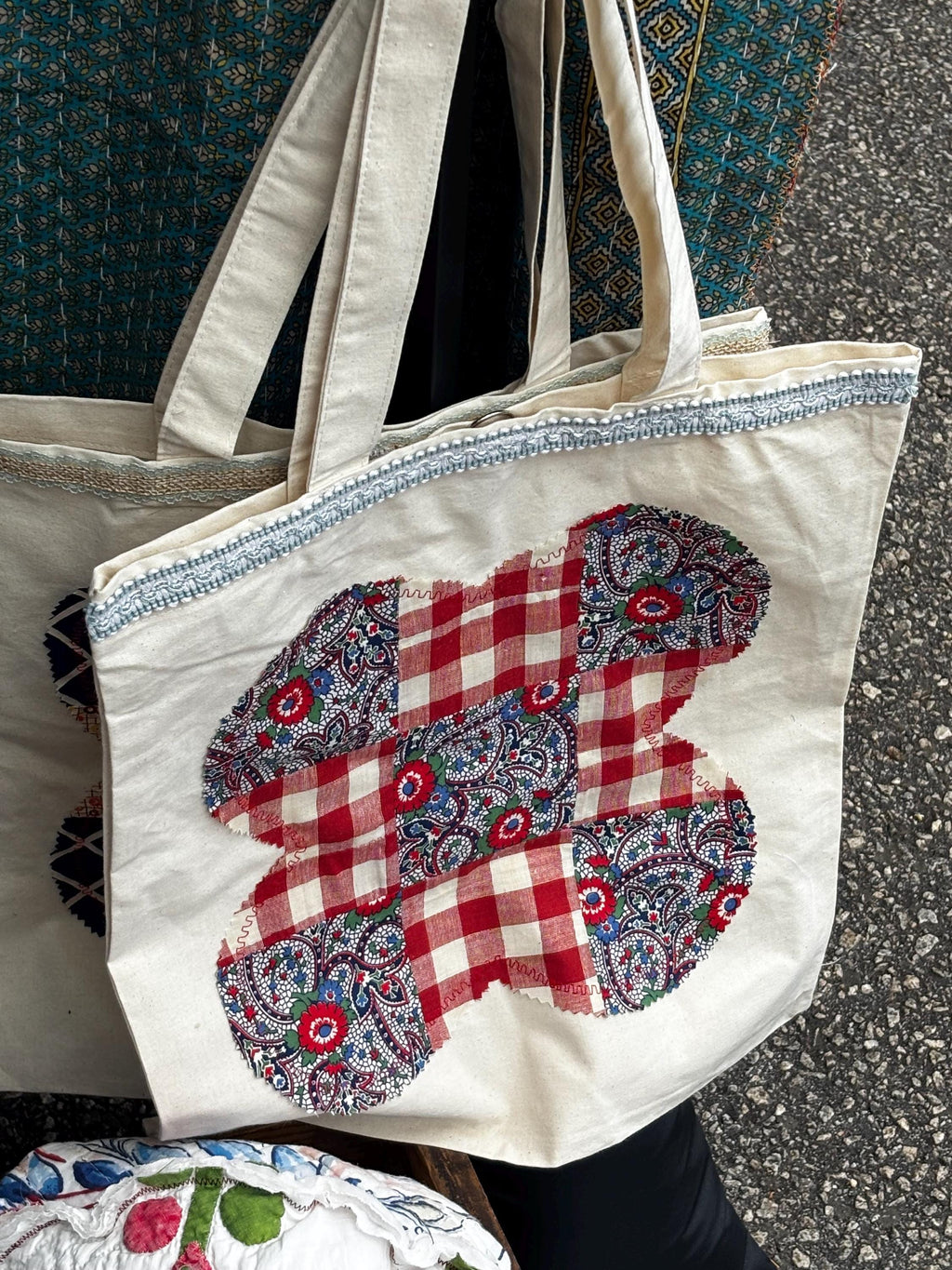 Assorted tote bags made from quilt squares